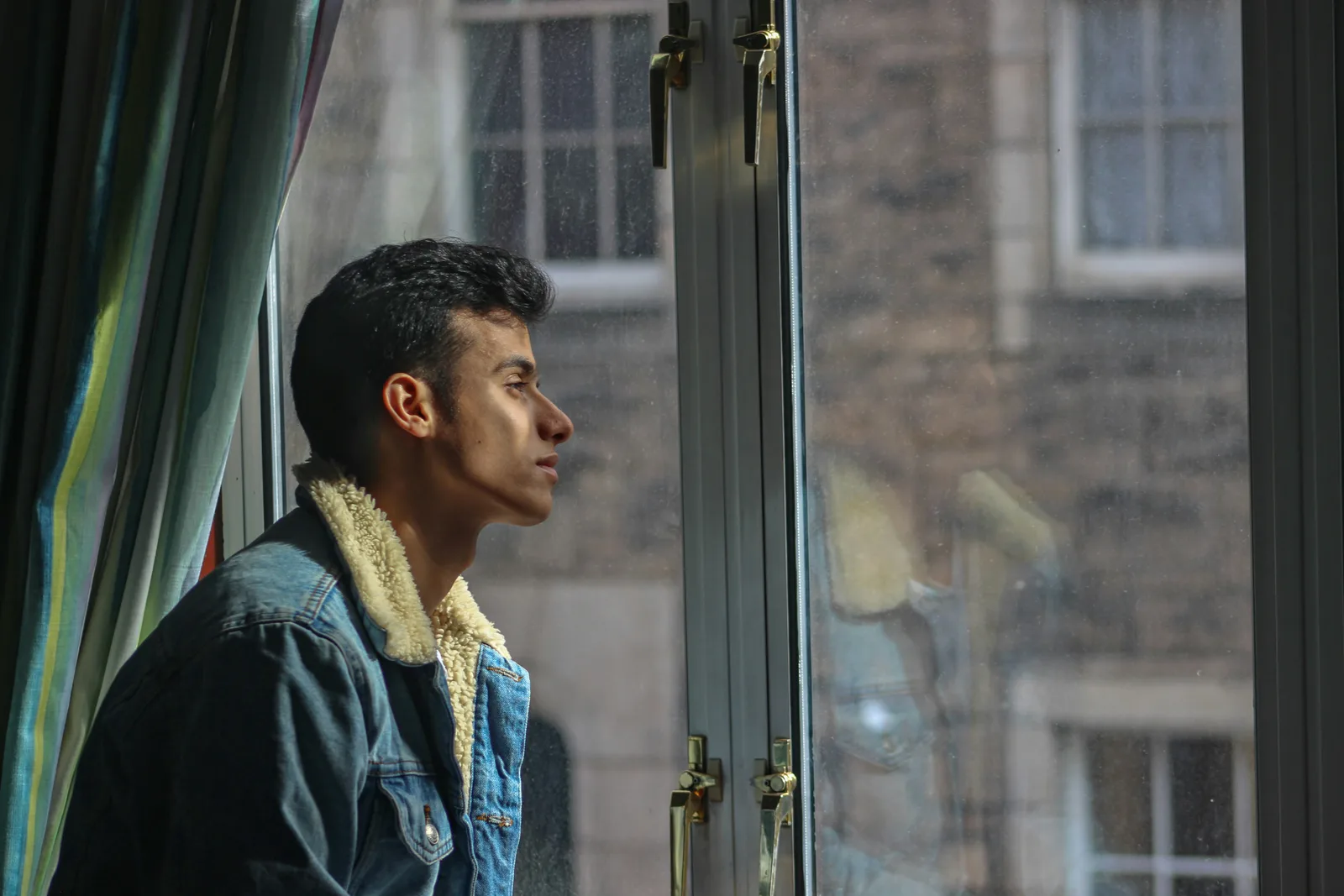 A man looking out of a window